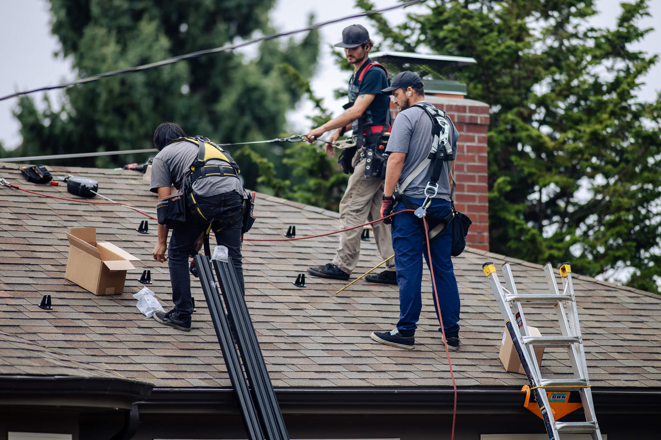 Construction team working on house roof