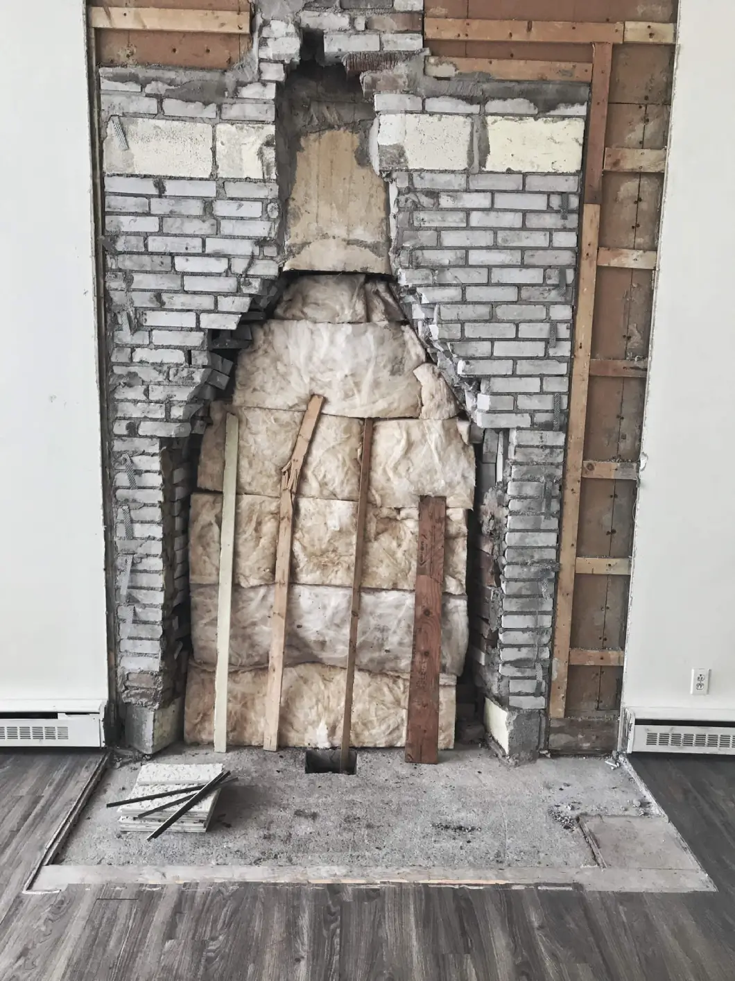 Unfinished chimney with wooden planks