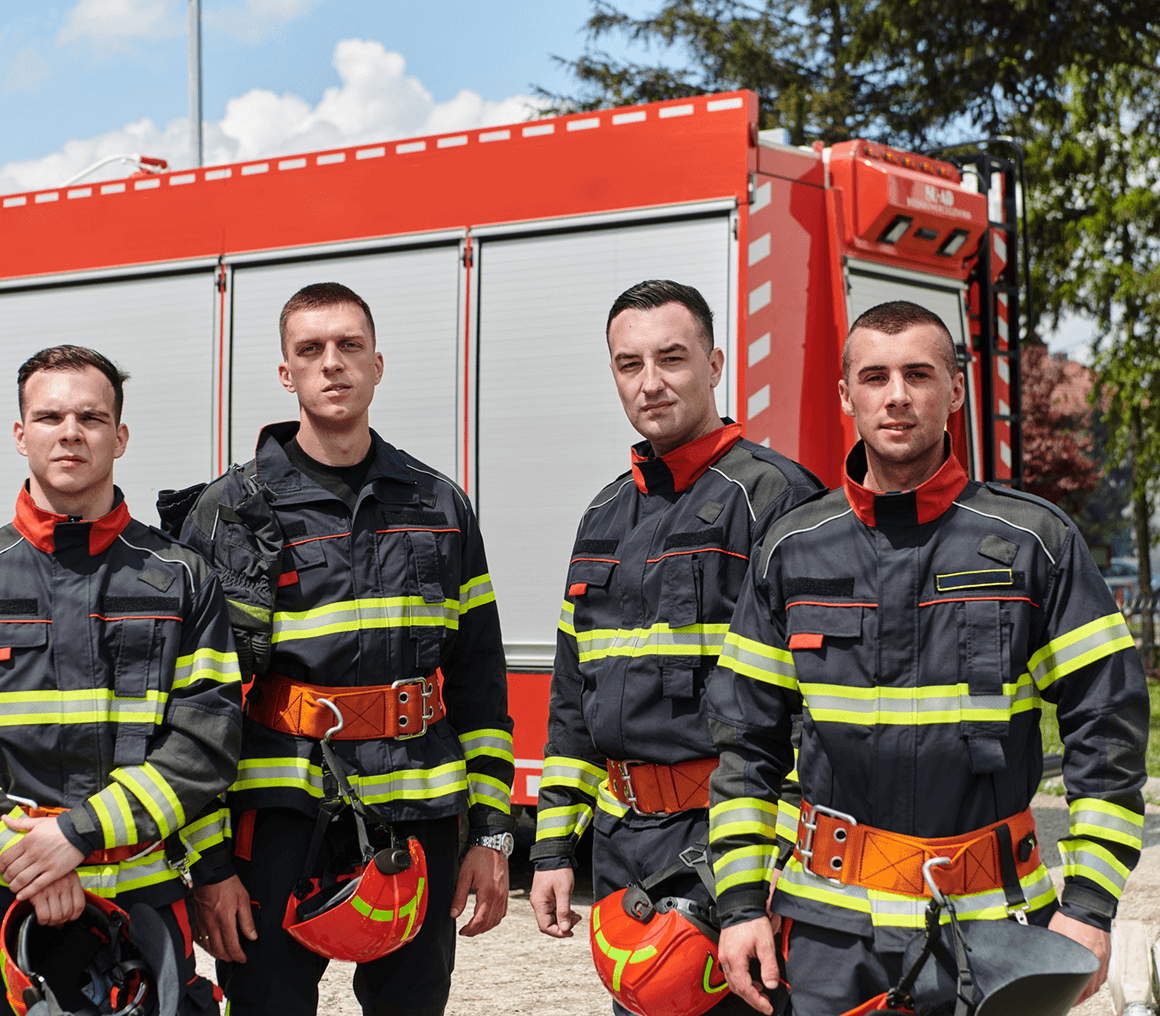 Fire crew in uniform with helmets