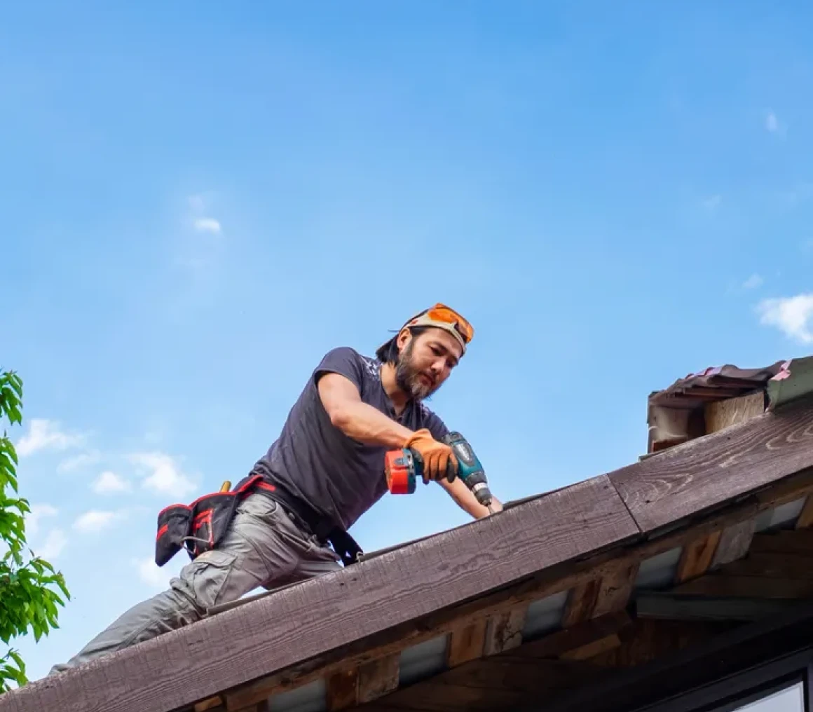 Man working on roof construction